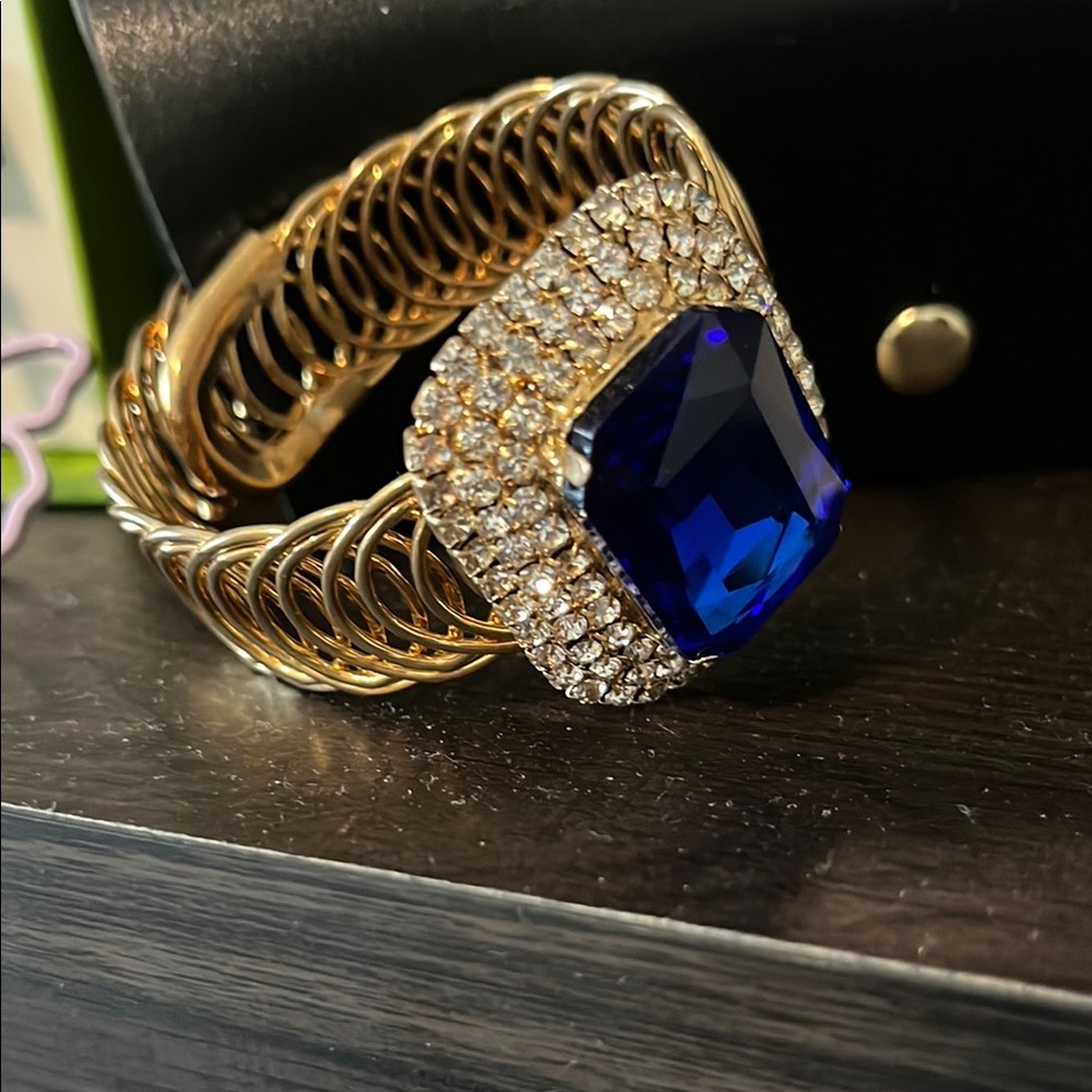 A Classy Chic Boutique Gold and Blue Bracelet with Intricate Design